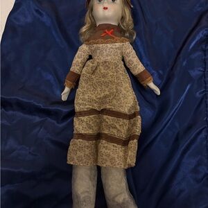 Vintage Style Porcelain Doll with Brown Dress